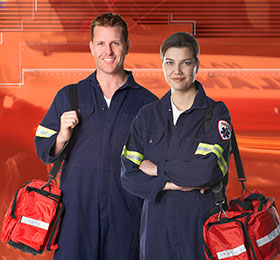 EMTs standing with equipment bags on their shoulders