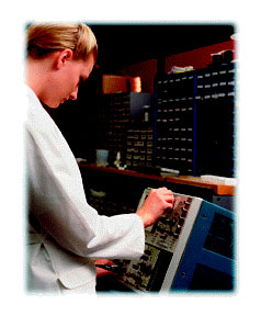 Technician working on electonic equipment