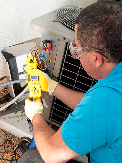 Man working on a heat pump