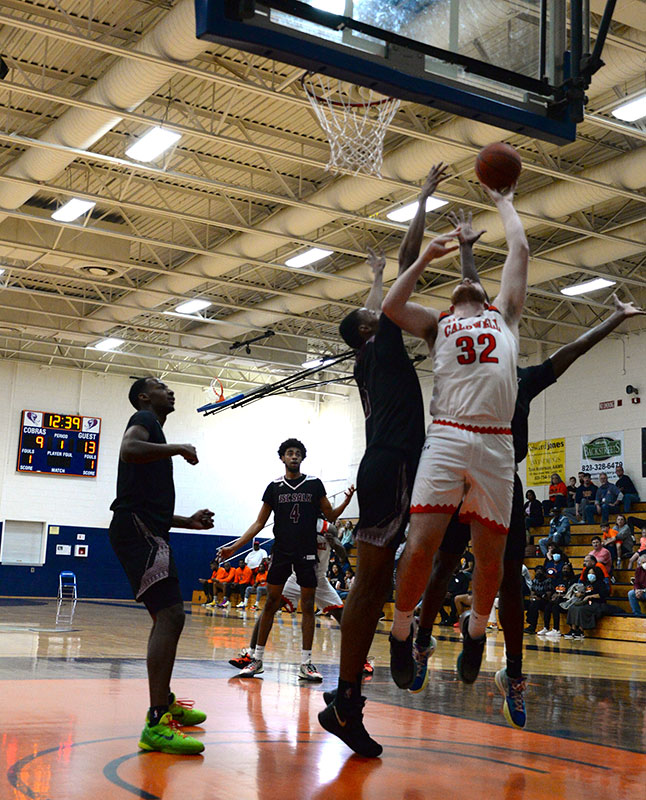 CCC&TI forward Caleb Mauldin (32) drives to the basket.