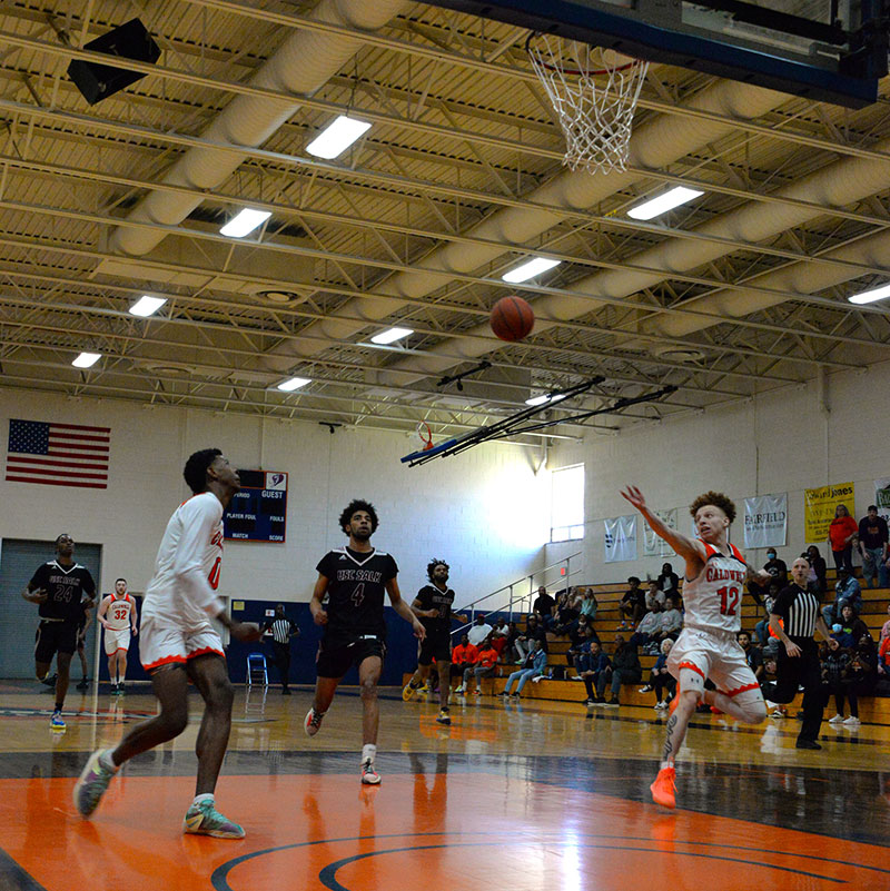 CCC&TI guard Isaiah Pruett (12) lobs a pass to Toyaz Solomon (0), who finished with a slam dunk.